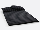 Illustration du couchage TentBox – draps-housses sur modèle compatible ; contenu Nuit Confort selon variante